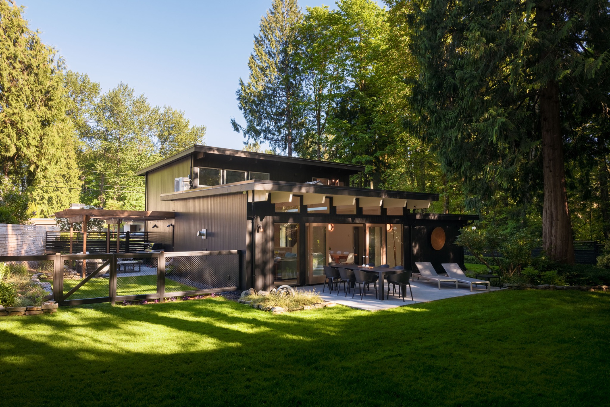 Outdoor room beneath a timber pergola